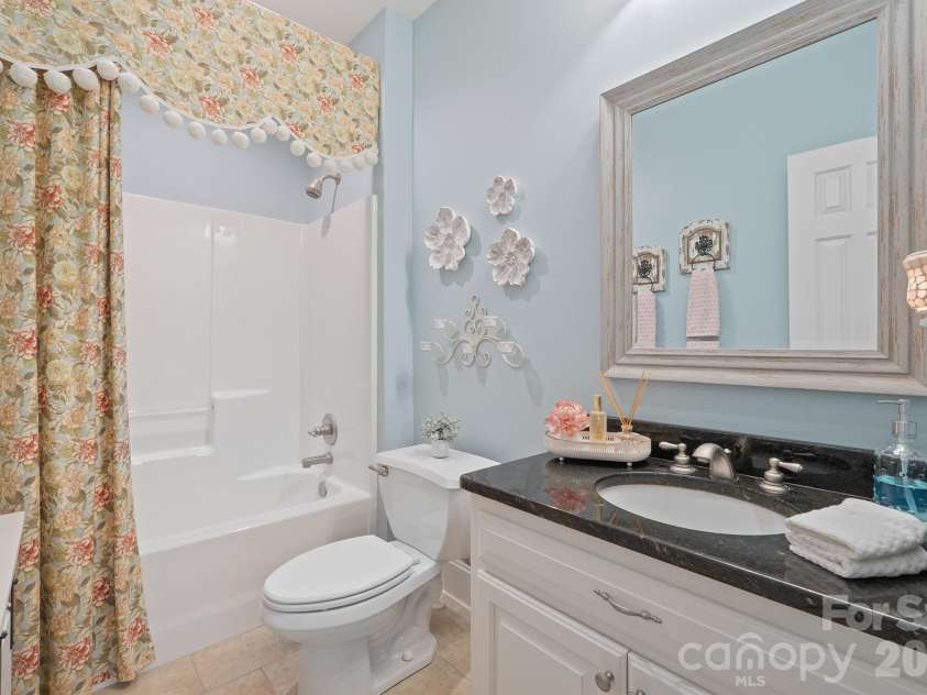 277 Glenwood Drive, Oakboro, NC 28129.  MLS# CAR4312178, YatesRealty ID 45923. Downstairs 2nd bath with granite countertops and tile floors