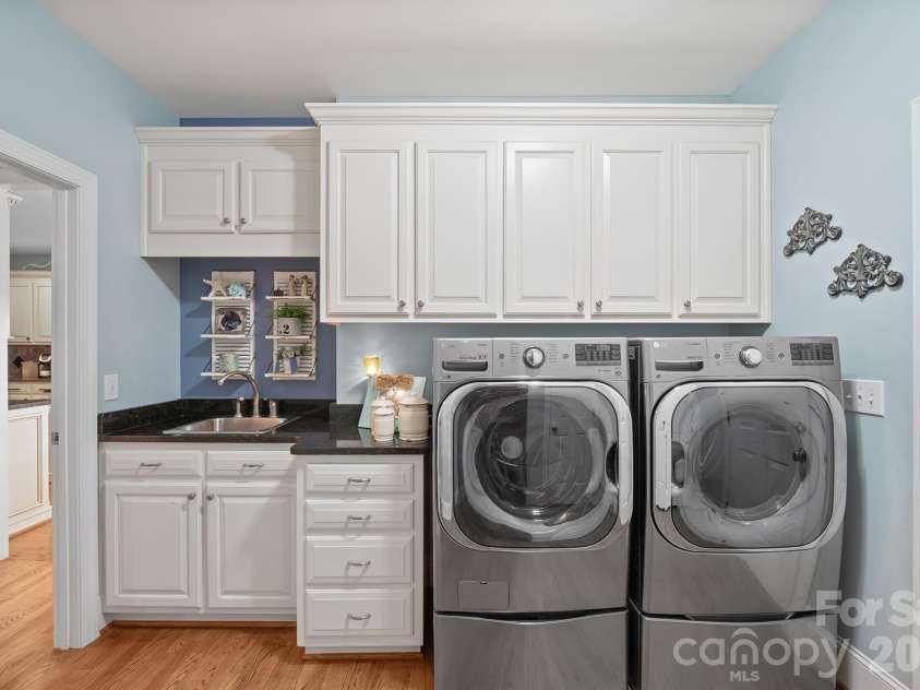 277 Glenwood Drive, Oakboro, NC 28129.  MLS# CAR4312178, YatesRealty ID 45923. Laundry room with cabinetry and closet
