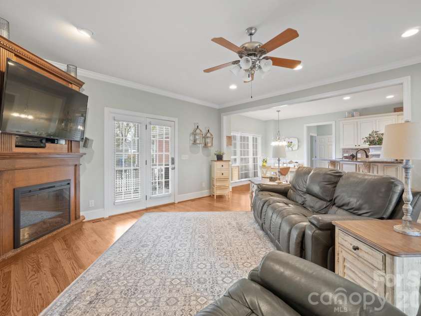 277 Glenwood Drive, Oakboro, NC 28129.  MLS# CAR4312178, YatesRealty ID 45923. Open concept living with door leading out to large back porch overlooking the pool