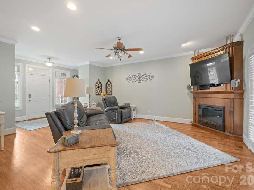 277 Glenwood Drive, Oakboro, NC 28129.  MLS# CAR4312178, YatesRealty ID 45923. Real hardwoods in the living room and an electric fireplace that can also utilize gas logs