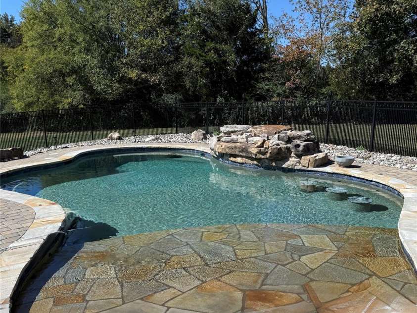 277 Glenwood Drive, Oakboro, NC 28129.  MLS# CAR4312178, YatesRealty ID 45923. Salt water pool - heater and a/c - natural stone water fall