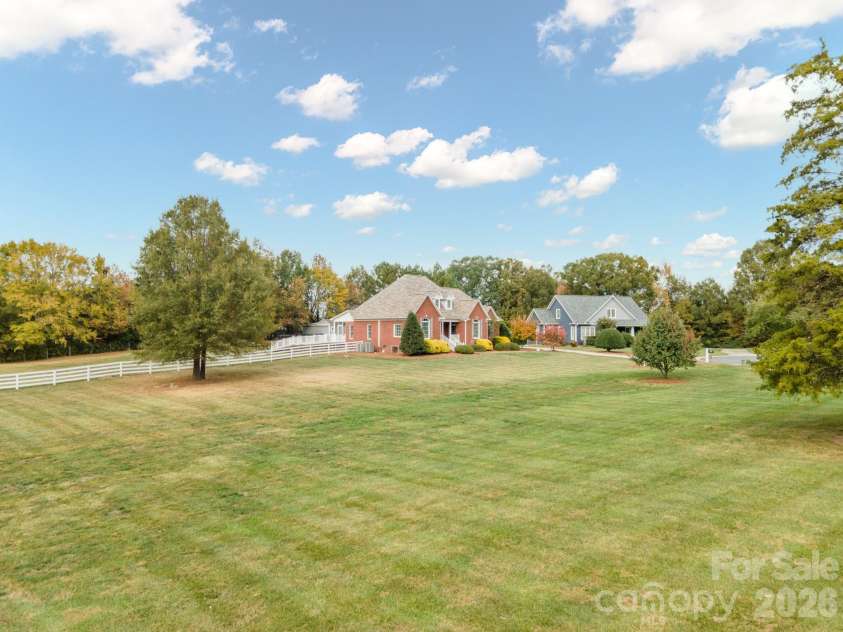 277 Glenwood Drive, Oakboro, NC 28129.  MLS# CAR4312178, YatesRealty ID 45923. Shows part of buildable lot included in price of home.