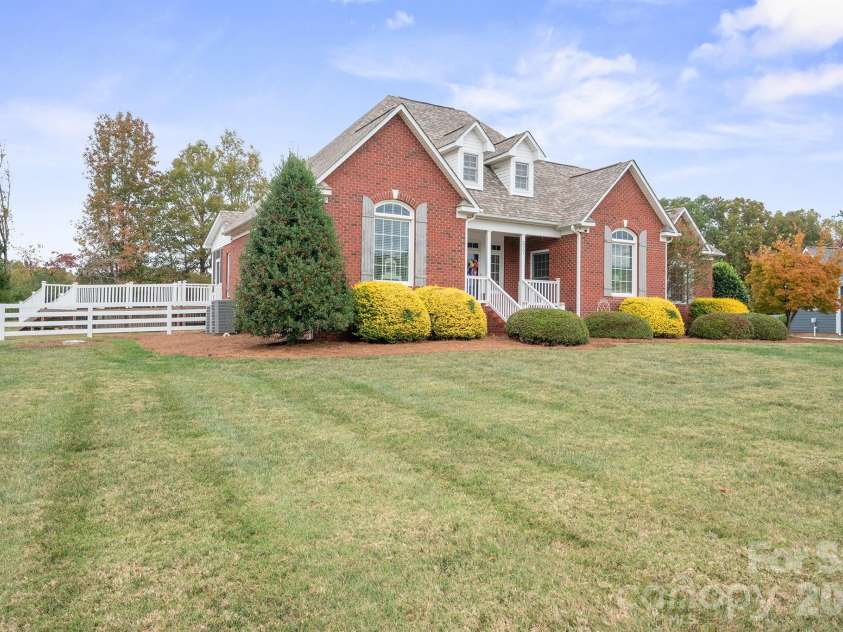 277 Glenwood Drive, Oakboro, NC 28129.  MLS# CAR4312178, YatesRealty ID 45923. Shows ramp to the left of house 