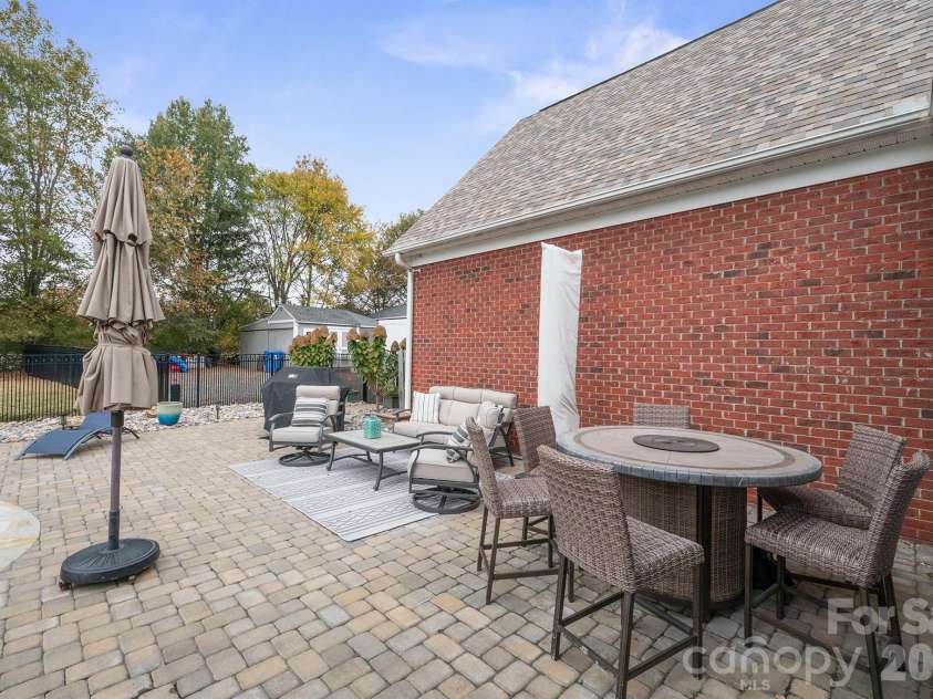 277 Glenwood Drive, Oakboro, NC 28129.  MLS# CAR4312178, YatesRealty ID 45923. Trees and garage add to wonderful private backyard