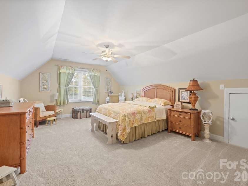 277 Glenwood Drive, Oakboro, NC 28129.  MLS# CAR4312178, YatesRealty ID 45923. Upstairs bedroom 1 with attic storage on both sides and huge walk in closet