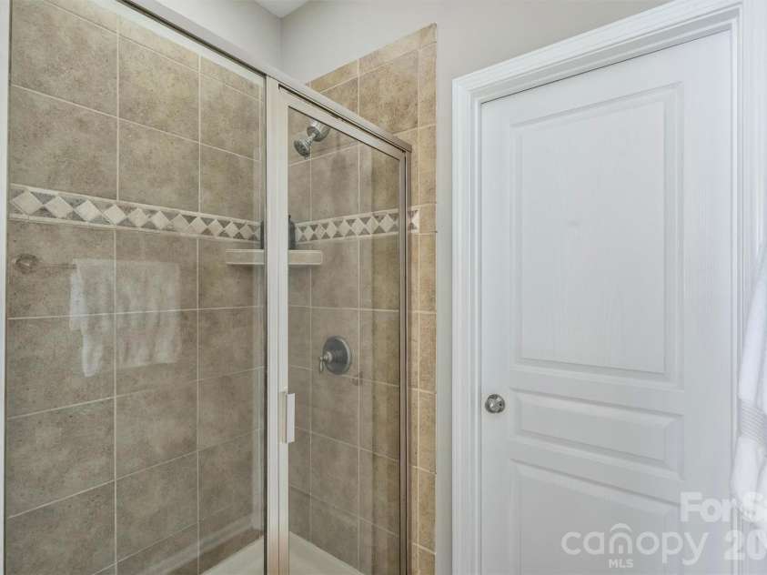 1136 Aringill Lane, Matthews, NC 28104.  MLS# CAR4415913, YatesRealty ID 45924. Primary shower.
