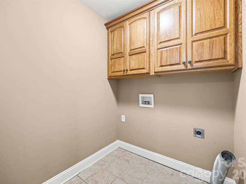 2229 Starnes Road, Edgemoor, SC 29712.  MLS# CAR4409854, YatesRealty ID 45934. Laundry room with storage.
