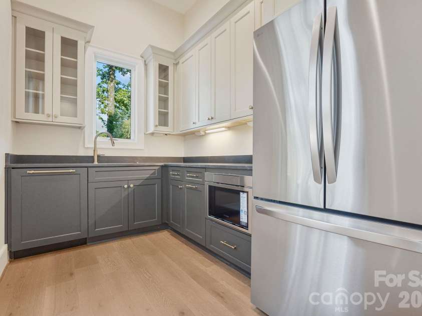 21216 Rio Oro Drive, Cornelius, NC 28031.  MLS# CAR4425303, YatesRealty ID 45943. Scullery - perfect for keeping the mess hidden!