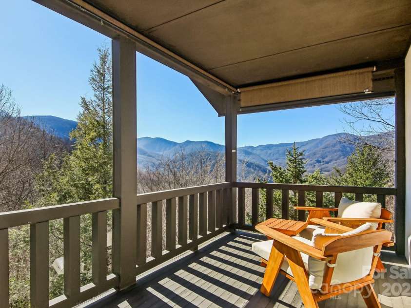 821 Summit Drive, Maggie Valley, NC 28751.  MLS# CAR4225220, YatesRealty ID 4600. Another angle porch mountain views