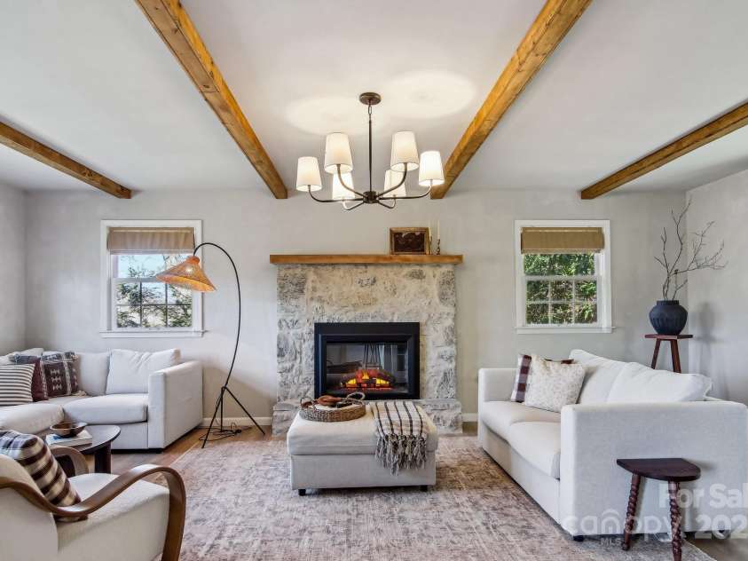 821 Summit Drive, Maggie Valley, NC 28751.  MLS# CAR4225220, YatesRealty ID 4600. Fireplace family room