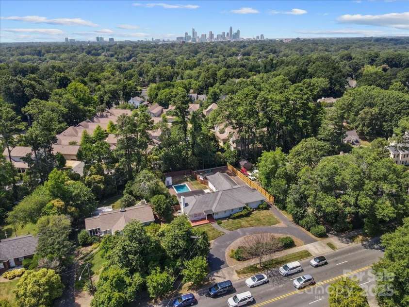 1626 Wendover Road, Charlotte, NC 28211.  MLS# CAR4155569, YatesRealty ID 4601. Aerial view of the home with Charlotte city skyline in the back.