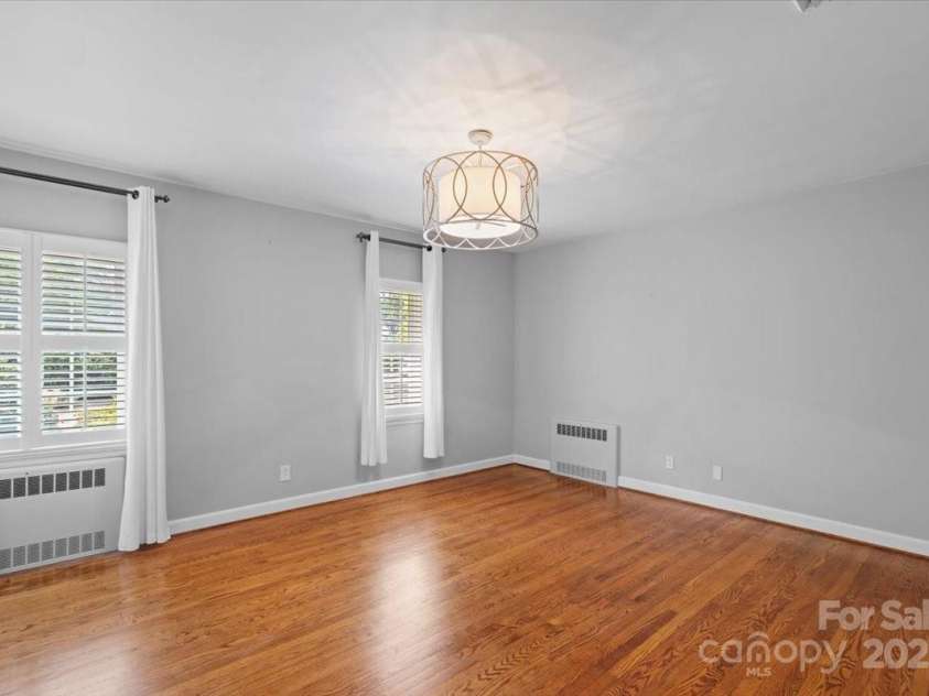 1626 Wendover Road, Charlotte, NC 28211.  MLS# CAR4155569, YatesRealty ID 4601. Bedroom 2 with hardwoods, plantation shutters and flat ceilings.