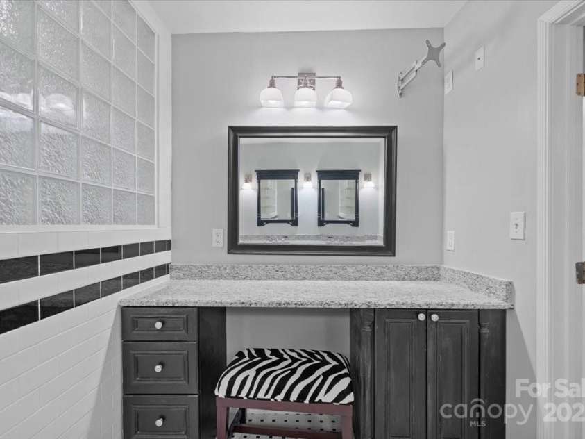 1626 Wendover Road, Charlotte, NC 28211.  MLS# CAR4155569, YatesRealty ID 4601. Built in vanity in the primary bathroom.