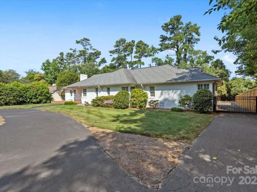 1626 Wendover Road, Charlotte, NC 28211.  MLS# CAR4155569, YatesRealty ID 4601. Gated rear parking entrance with privacy fence