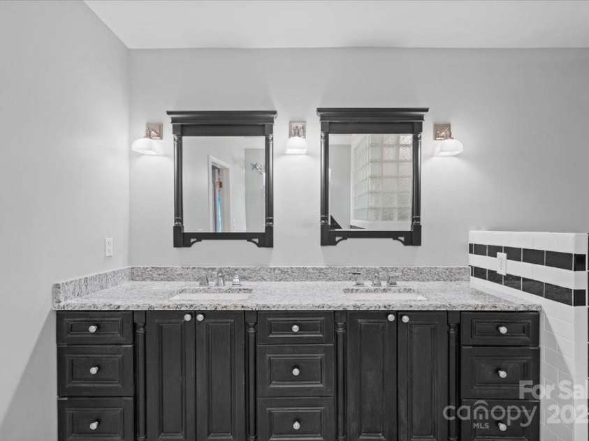 1626 Wendover Road, Charlotte, NC 28211.  MLS# CAR4155569, YatesRealty ID 4601. Large dual sink vanity in the primary bathroom.