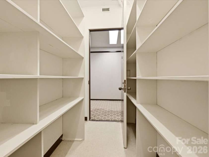 806 Cherokee Road, Charlotte, NC 28207.  MLS# CAR4415796, YatesRealty ID 46018. Storage closet with shelving