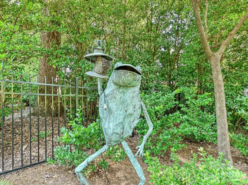 806 Cherokee Road, Charlotte, NC 28207.  MLS# CAR4415796, YatesRealty ID 46018. Whimsical artwork in the garden