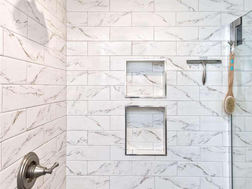 3882 New Leicester Highway, Leicester, NC 28748.  MLS# CAR4168284, YatesRealty ID 4603. A closer look at the newly tiled shower in the primary bathroom