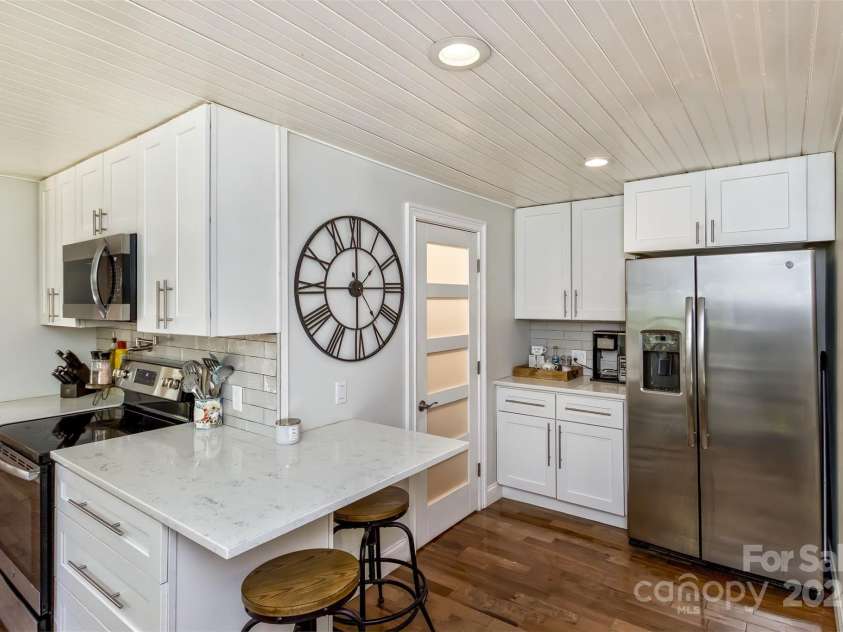 3882 New Leicester Highway, Leicester, NC 28748.  MLS# CAR4168284, YatesRealty ID 4603. Breakfast bar, walk-in pantry, coffee bar and fridge