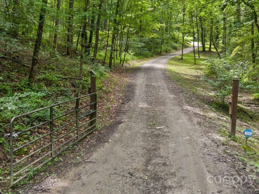 3882 New Leicester Highway, Leicester, NC 28748.  MLS# CAR4168284, YatesRealty ID 4603. Gate off New Leicester Highway and gravel driveway up to the house