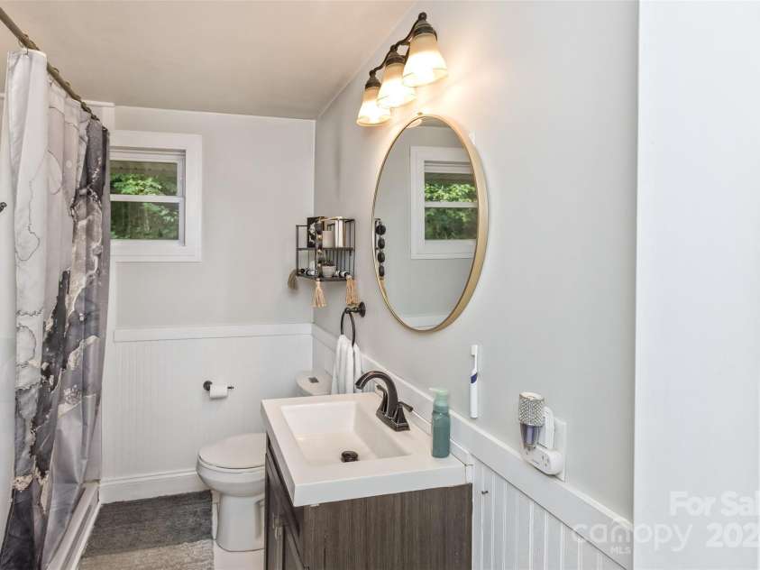 3882 New Leicester Highway, Leicester, NC 28748.  MLS# CAR4168284, YatesRealty ID 4603. Hall bathroom, for guests and the two secondary bathrooms