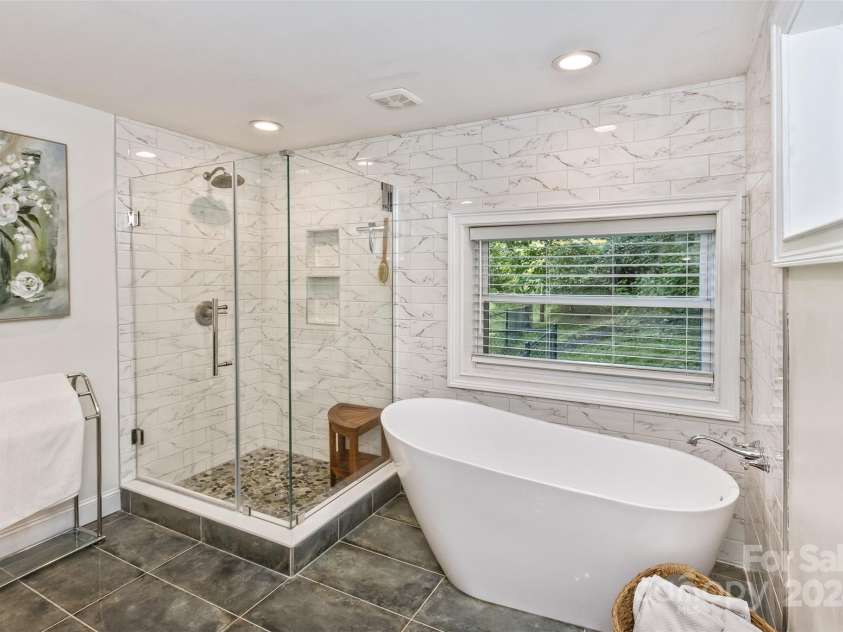 3882 New Leicester Highway, Leicester, NC 28748.  MLS# CAR4168284, YatesRealty ID 4603. Primary bathroom, newly retiled and with free-standing tub