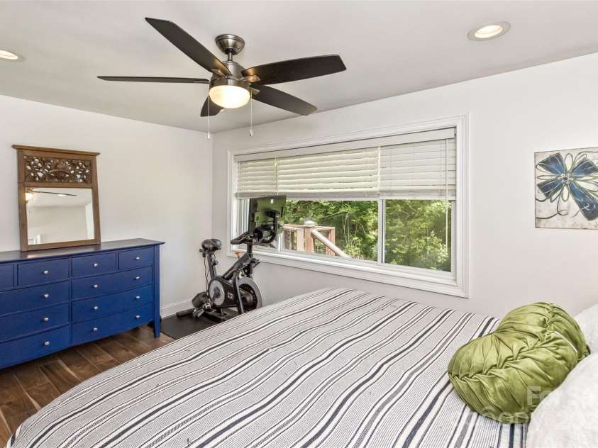 3882 New Leicester Highway, Leicester, NC 28748.  MLS# CAR4168284, YatesRealty ID 4603. Primary bedroom, love the ceiling fans in all the bedrooms!