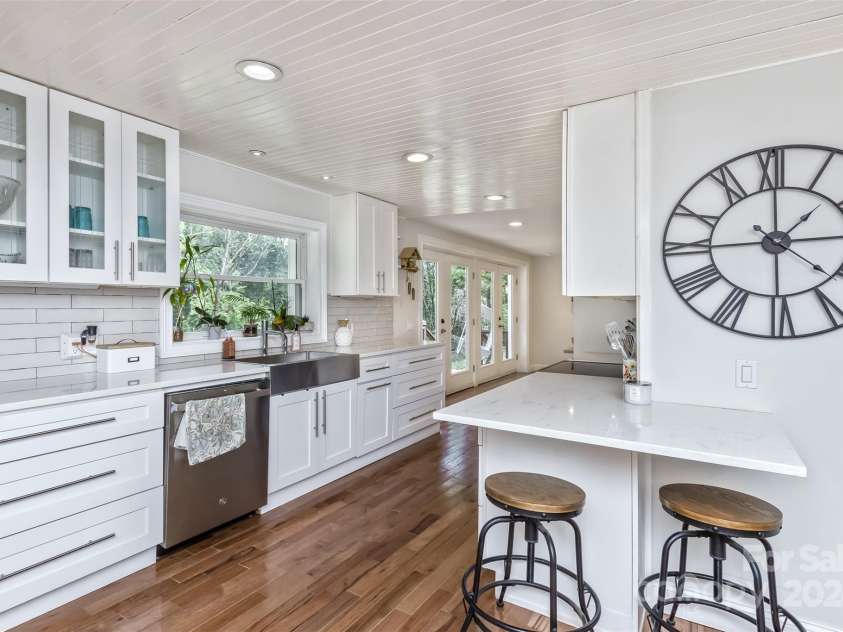 3882 New Leicester Highway, Leicester, NC 28748.  MLS# CAR4168284, YatesRealty ID 4603. Up several stairs to the kitchen