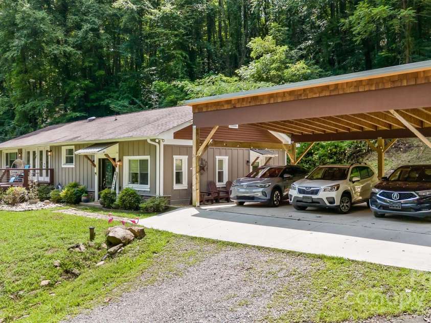 3882 New Leicester Highway, Leicester, NC 28748.  MLS# CAR4168284, YatesRealty ID 4603. View from the shed area - ample room for 3 cars in the carport, more parking by the shed