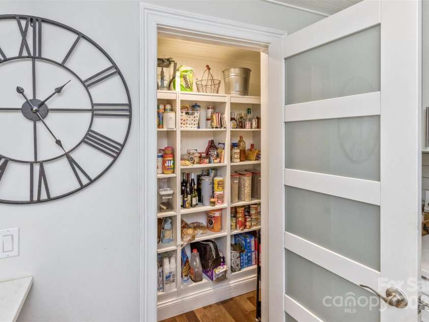 3882 New Leicester Highway, Leicester, NC 28748.  MLS# CAR4168284, YatesRealty ID 4603. Walk-in pantry to the right of stairs