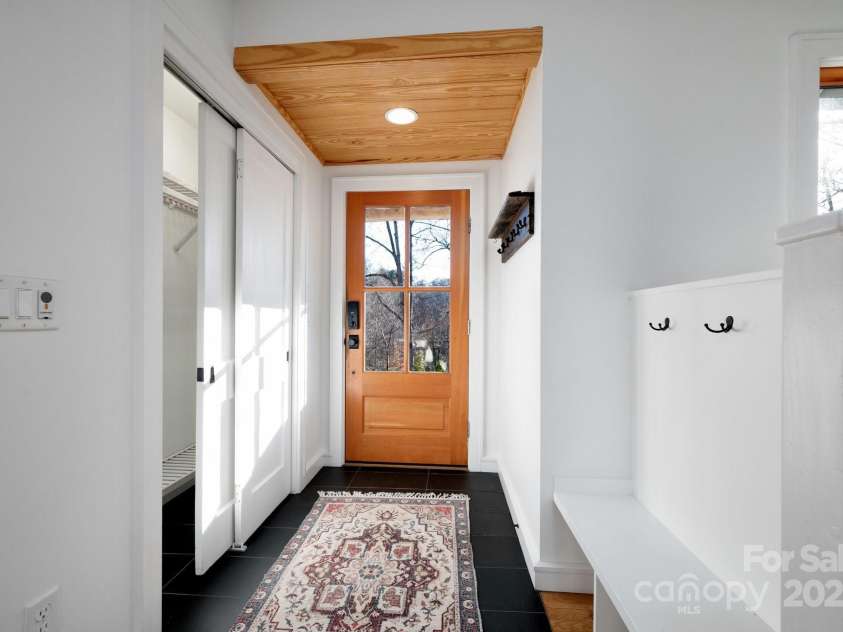 122 and 124 Shelburne Road, Asheville, NC 28806.  MLS# CAR4232938, YatesRealty ID 4604. Inviting Foyer with Coat Closet and Sitting Bench