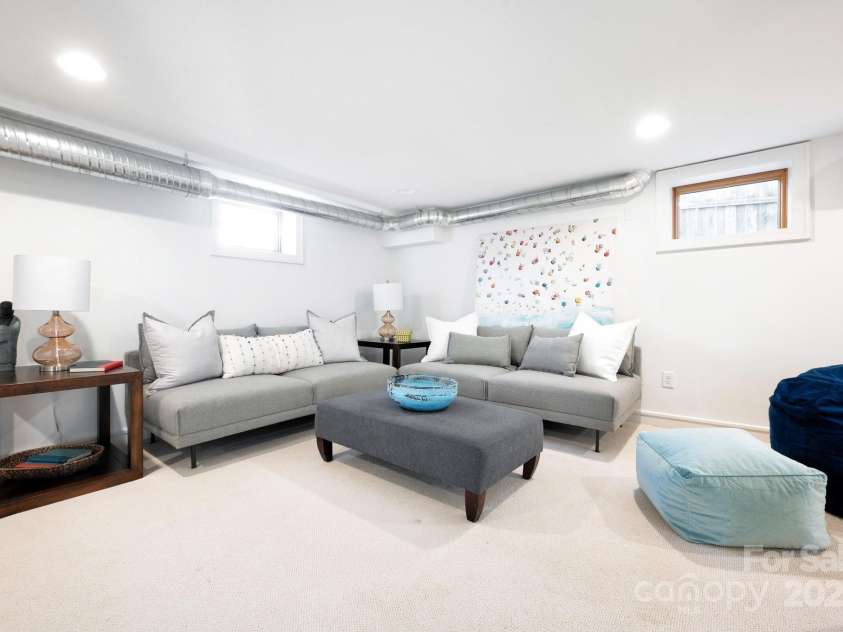 122 and 124 Shelburne Road, Asheville, NC 28806.  MLS# CAR4232938, YatesRealty ID 4604. Versatile Lower-Level Recreation/Living Room