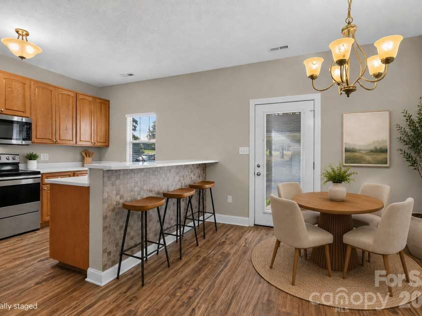 105 Putter Place, Mooresville, NC 28115.  MLS# CAR4417071, YatesRealty ID 46052. Virtually Staged Dining Area