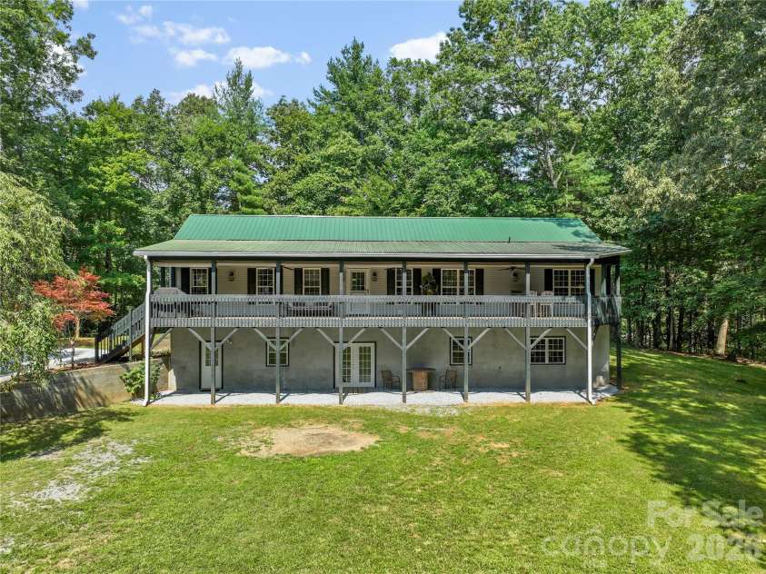 2230 Walnut Hollow Road, Brevard, NC 28712.  MLS# CAR4416763, YatesRealty ID 46059. Expansive front covered deck