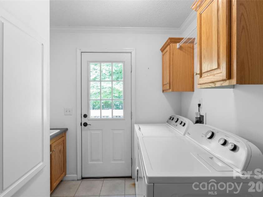 2230 Walnut Hollow Road, Brevard, NC 28712.  MLS# CAR4416763, YatesRealty ID 46059. Laundry area w/ sink