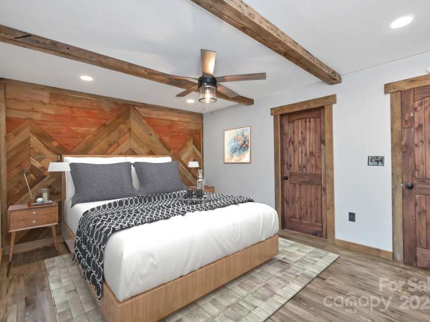 486 Hunter-Lysik Way, Laurel Springs, NC 28644.  MLS# CAR4325096, YatesRealty ID 4607. Main Level Primary Bedroom - Virtually Staged