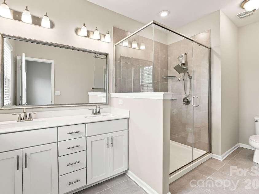 9604 Ainslie Downs Street, Charlotte, NC 28273.  MLS# CAR4416440, YatesRealty ID 46075. Owners bath