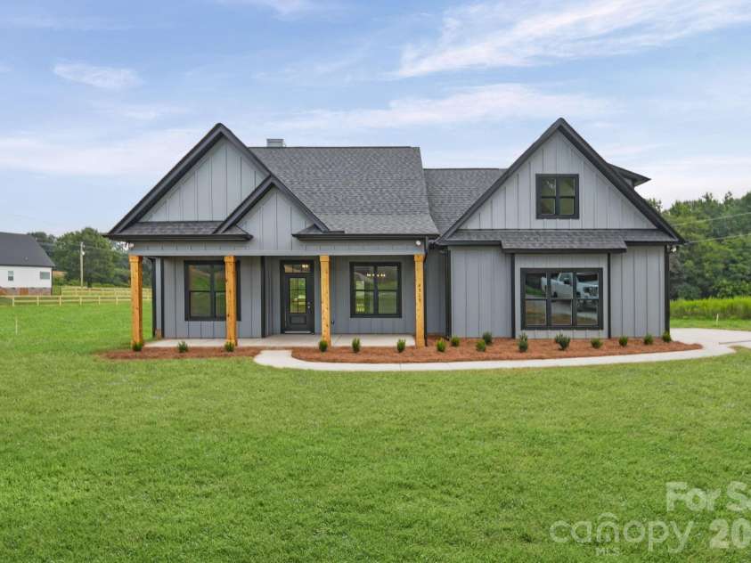 4515 Marvin Simpson Road, Marshville, NC 28103.  MLS# CAR4411738, YatesRealty ID 46083. Grass is AI generated