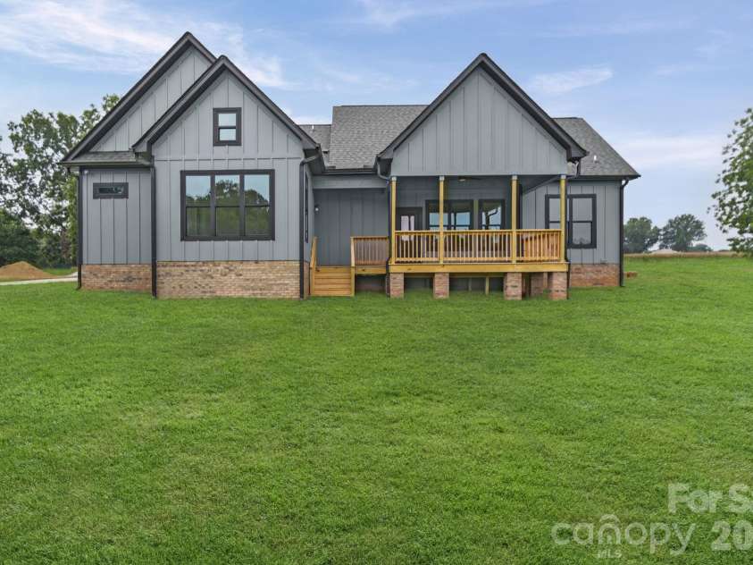 4515 Marvin Simpson Road, Marshville, NC 28103.  MLS# CAR4411738, YatesRealty ID 46083. Grass is AI generated