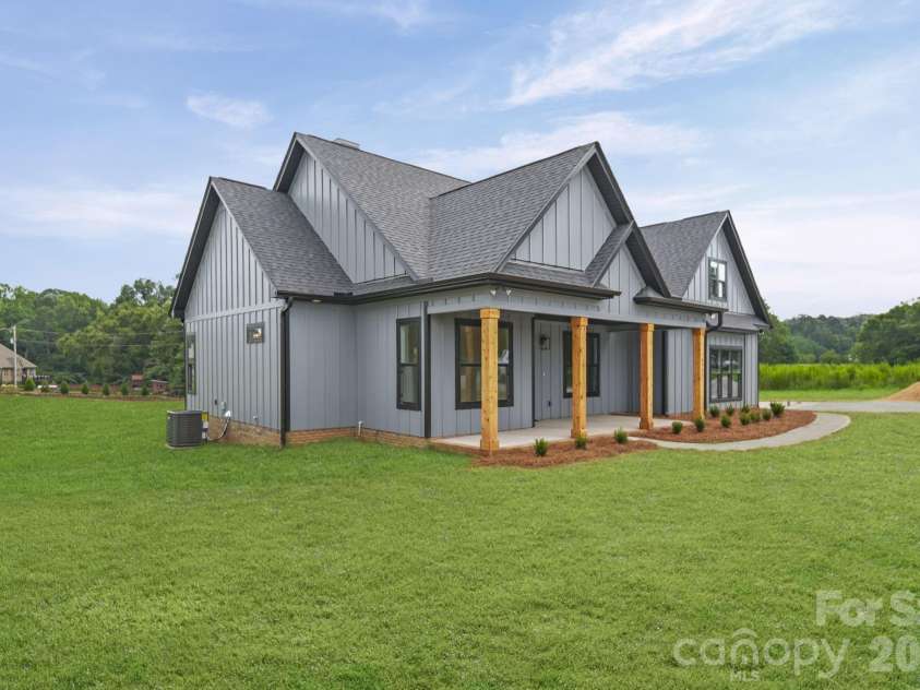 4515 Marvin Simpson Road, Marshville, NC 28103.  MLS# CAR4411738, YatesRealty ID 46083. Grass is AI generated