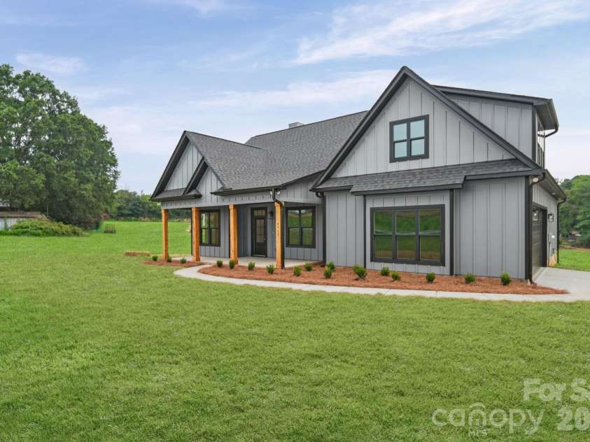 4515 Marvin Simpson Road, Marshville, NC 28103.  MLS# CAR4411738, YatesRealty ID 46083. Grass is AI generated