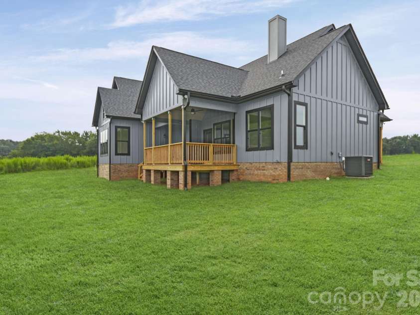 4515 Marvin Simpson Road, Marshville, NC 28103.  MLS# CAR4411738, YatesRealty ID 46083. Grass is AI generated