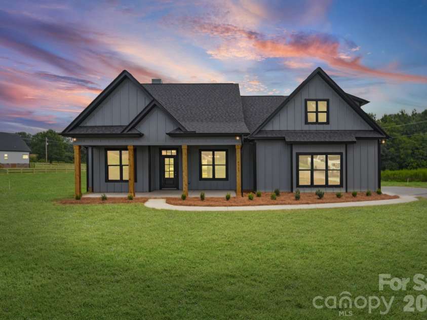 4515 Marvin Simpson Road, Marshville, NC 28103.  MLS# CAR4411738, YatesRealty ID 46083. Virtual Twilight-Grass is AI generated.