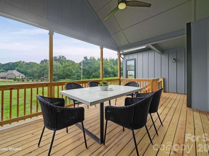 4515 Marvin Simpson Road, Marshville, NC 28103.  MLS# CAR4411738, YatesRealty ID 46083. Virtually Staged Rear Porch.