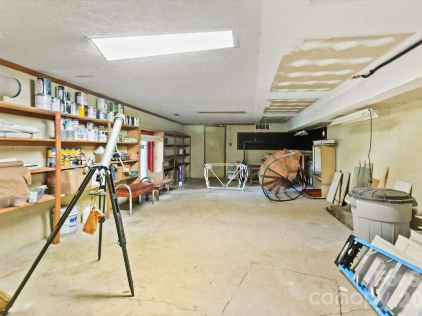 651 Glen Cannon Drive, Pisgah Forest, NC 28768.  MLS# CAR4414802, YatesRealty ID 46098. Basement area perfect for storage, hobbies or workshop