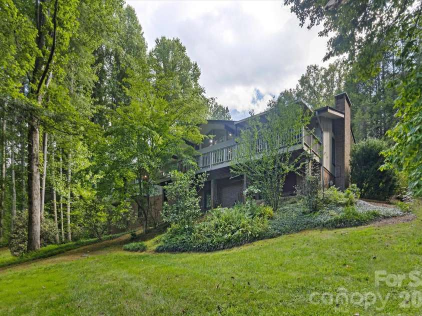651 Glen Cannon Drive, Pisgah Forest, NC 28768.  MLS# CAR4414802, YatesRealty ID 46098. Home from the back