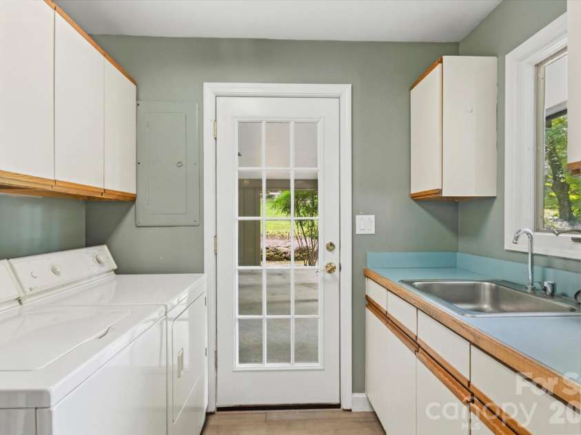 651 Glen Cannon Drive, Pisgah Forest, NC 28768.  MLS# CAR4414802, YatesRealty ID 46098. Laundry room on main level with sink