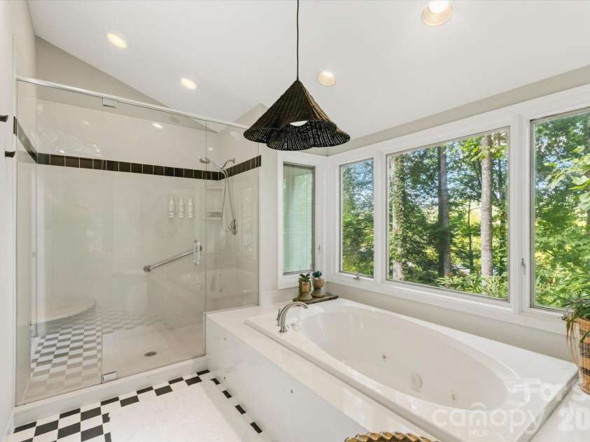 651 Glen Cannon Drive, Pisgah Forest, NC 28768.  MLS# CAR4414802, YatesRealty ID 46098. Walk in tile shower