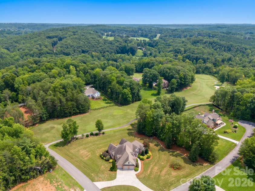 121 Cheyenne Lane, Statesville, NC 28677.  MLS# CAR4412107, YatesRealty ID 46100. Custom brick home overlooking the #6 teebox