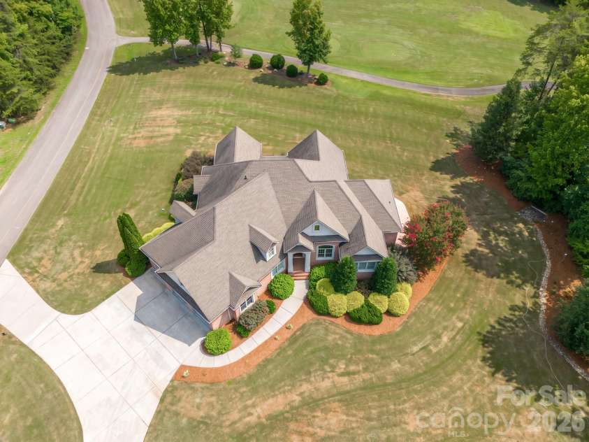 121 Cheyenne Lane, Statesville, NC 28677.  MLS# CAR4412107, YatesRealty ID 46100. Custom brick home overlooking the #6 teebox
